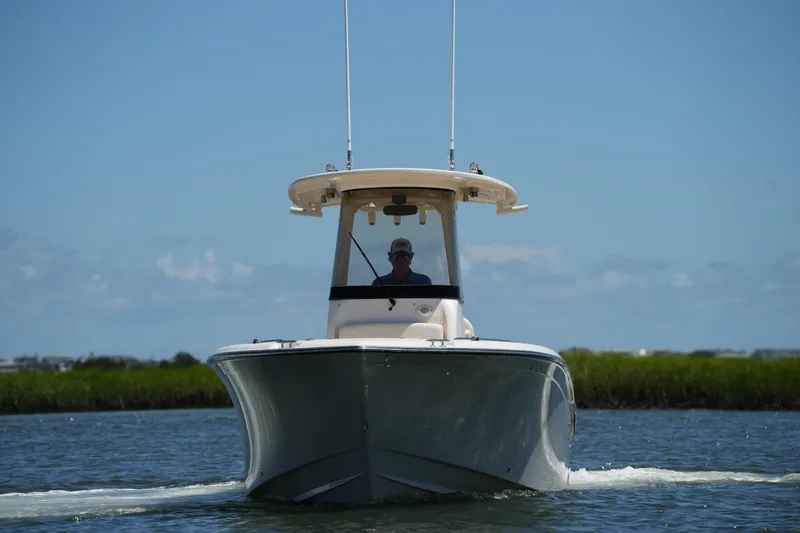 Slide: The Image of 2022 Grady-White Fisherman 257 boat cruising on a sunny day. - 4