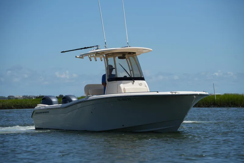 Slide: The Image of 2022 Grady-White Fisherman 257 boat cruising on a sunny day. - 9