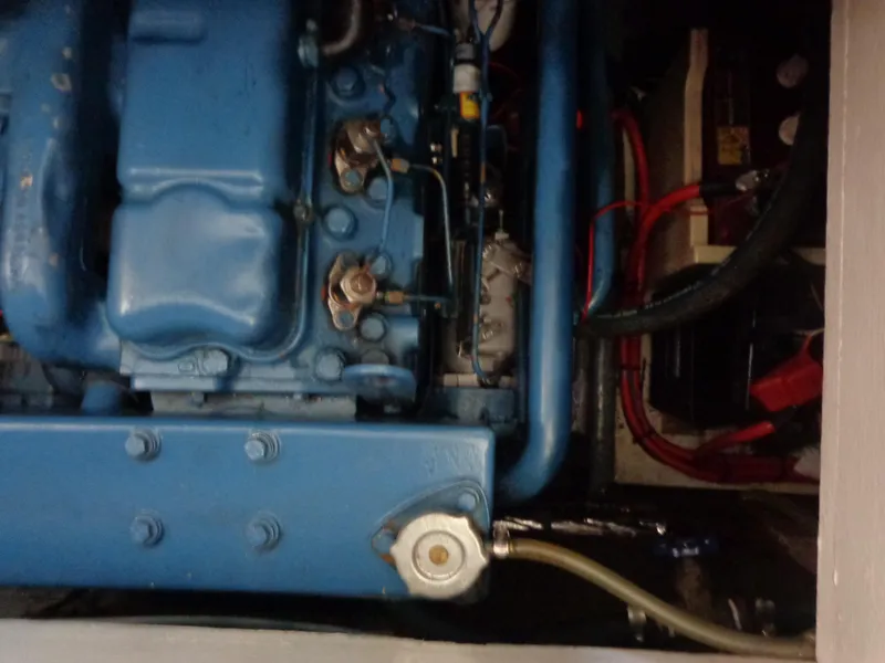 Slide: The Image of 1984 Sundowner Tug Pilothouse engine compartment with blue engine. - 27