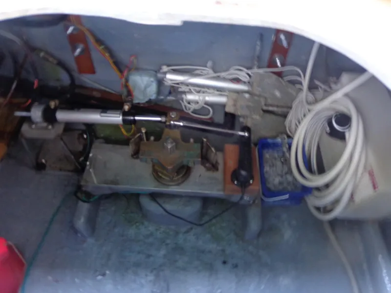 Slide: The Image of 1984 Sundowner Tug Pilothouse boat deck with wooden slats and railing. - 40