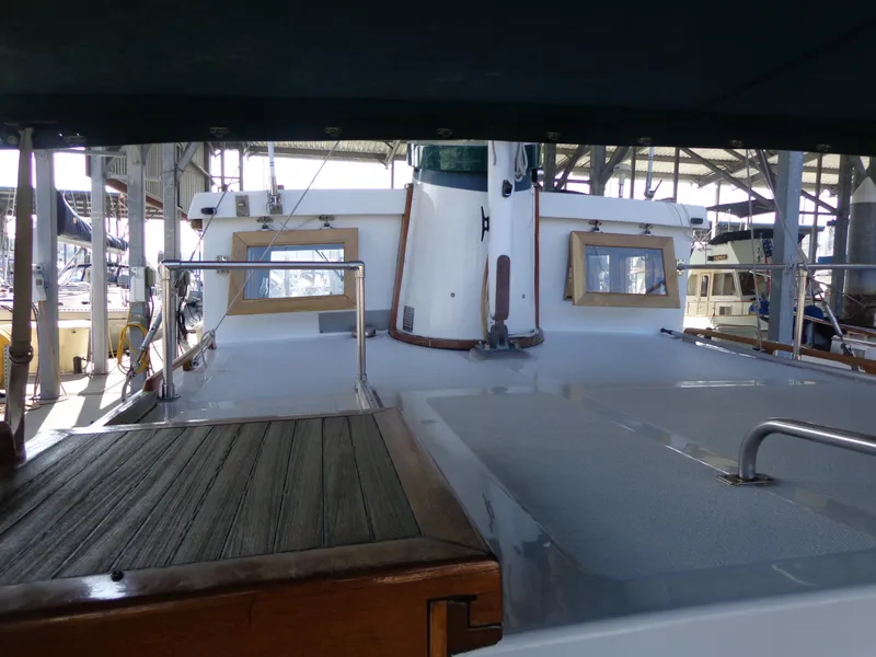 Slide: The Image of 1984 Sundowner Tug Pilothouse engine compartment with mechanical components and wiring. - 42