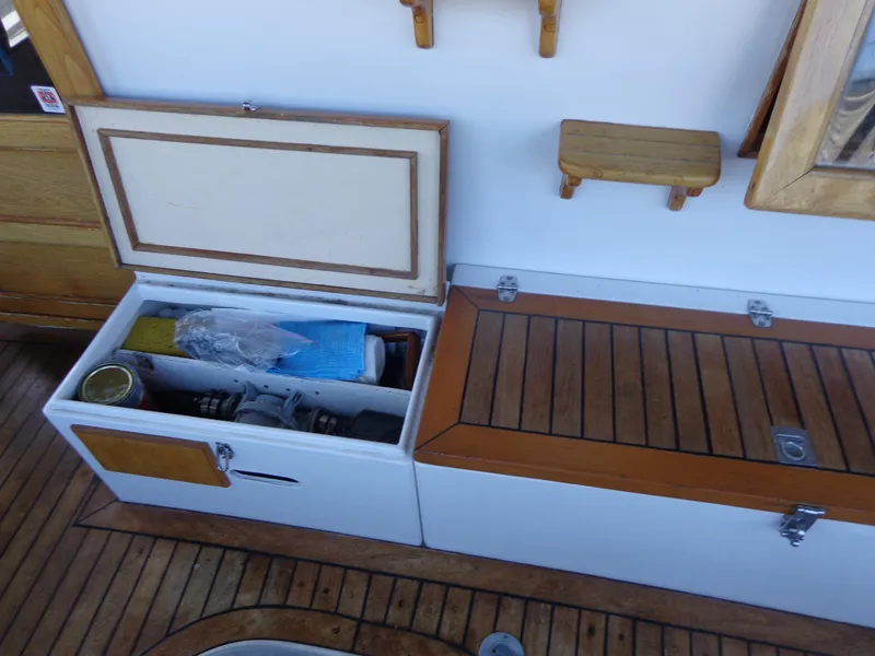 Slide: The Image of Open hatch on 1984 Sundowner Tug Pilothouse boat deck showing internal wiring and equipment. - 44