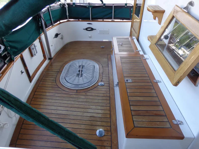 Slide: The Image of 1984 Sundowner Tug Pilothouse boat docked at marina. - 9