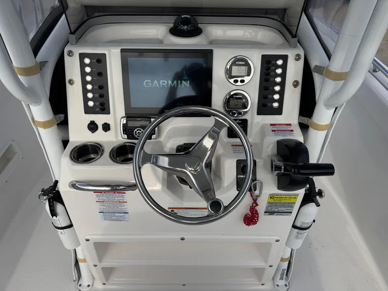Slide: The Image of 2020 Robalo R222 Center Console dashboard with Garmin display and controls. - 12