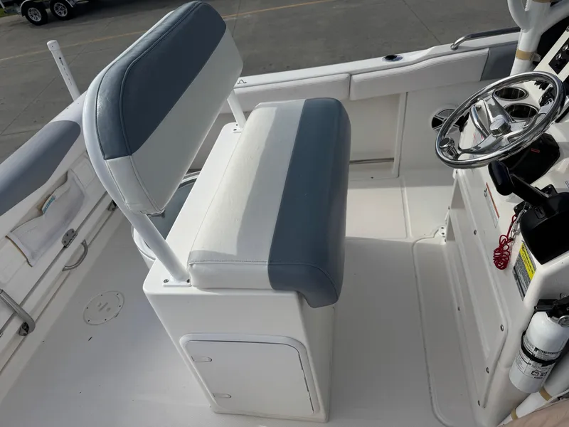 Slide: The Image of 2020 Robalo R222 Center Console boat interior with steering wheel and seating. - 14