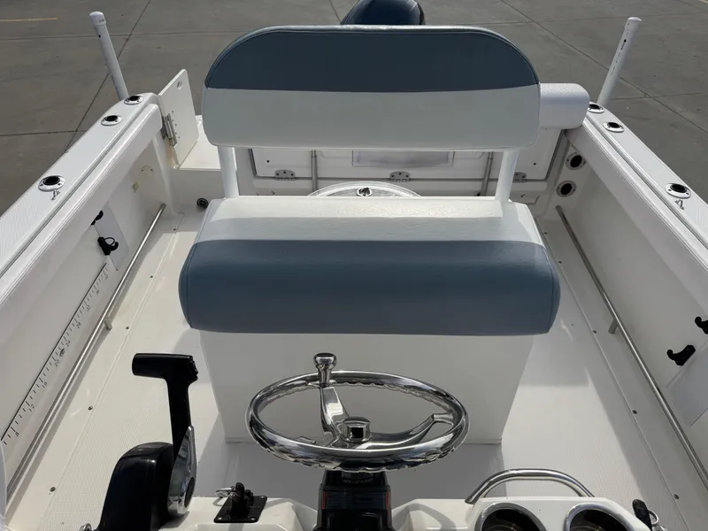 Slide: The Image of 2020 Robalo R222 Center Console boat interior with steering wheel and seating. - 15