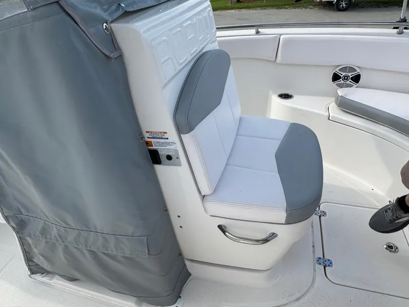 Slide: The Image of 2020 Robalo R222 Center Console boat seat with gray and white upholstery. - 18