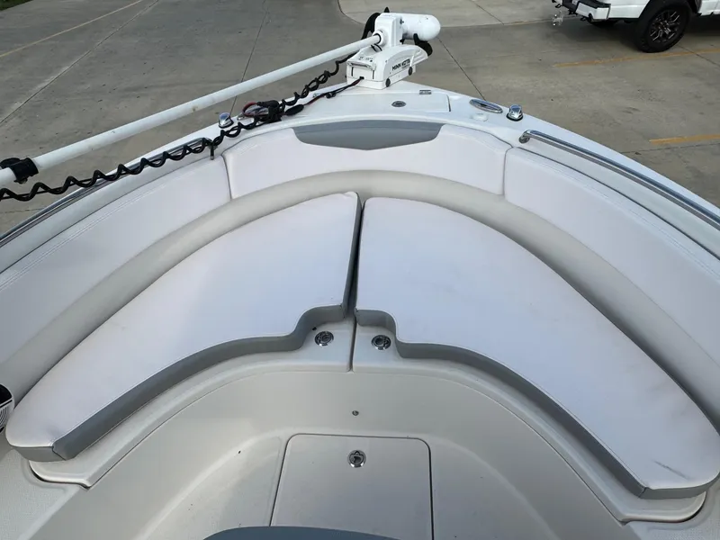 Slide: The Image of 2020 Robalo R222 Center Console boat with cushioned seating and trolling motor. - 19