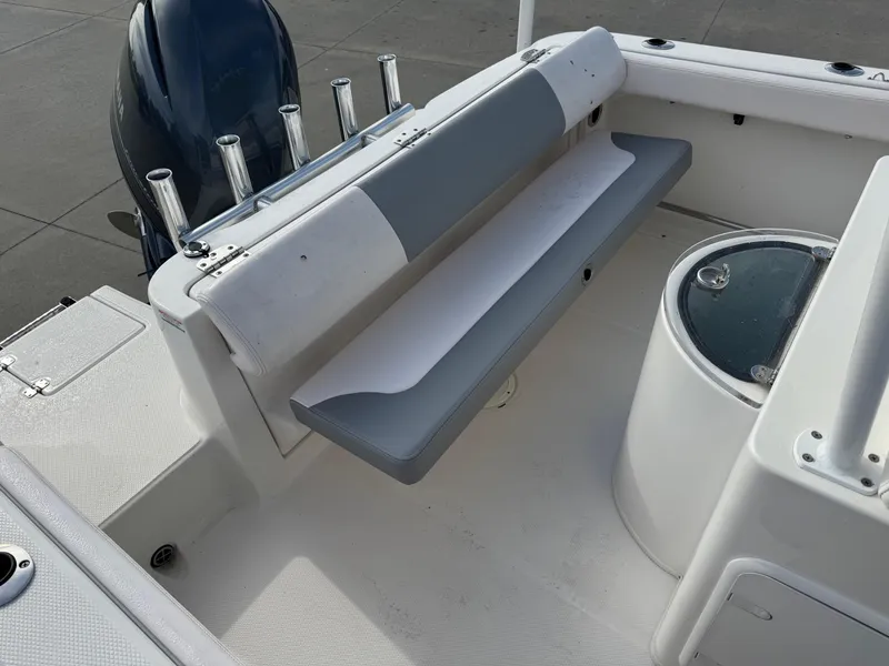 Slide: The Image of 2020 Robalo R222 Center Console boat interior with seating and storage. - 8