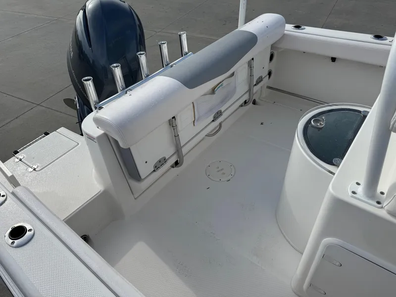 Slide: The Image of 2020 Robalo R222 Center Console boat interior with seating and rod holders. - 9