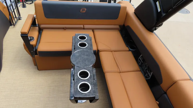 Slide: The Image of Luxurious seating on 2025 Princecraft Vogue 27 RL boat with cup holders and armrests. - 10