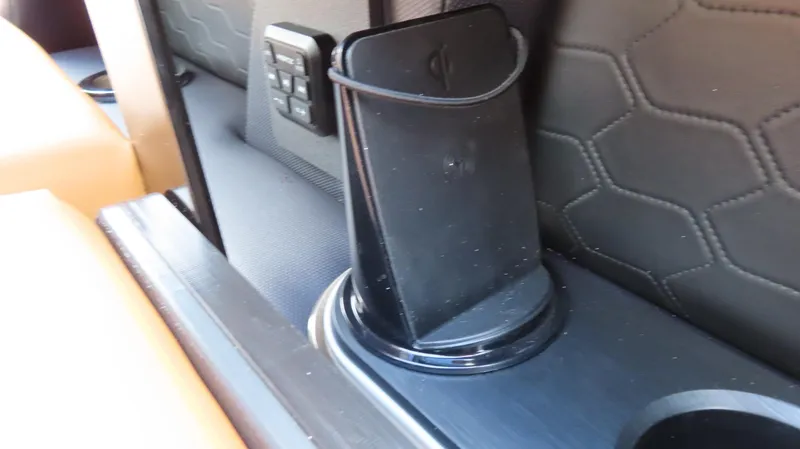 Slide: The Image of 2025 Princecraft Vogue 27 RL interior with phone holder and control panel. - 11