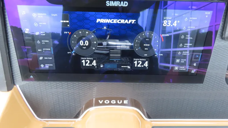 Slide: The Image of Dashboard display of 2025 Princecraft Vogue 27 RL boat, showing battery levels and controls. - 20