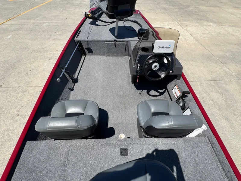 Slide: The Image of 2020 Bass Tracker Classic 16 boat interior with Garmin navigation system and seating. - 6