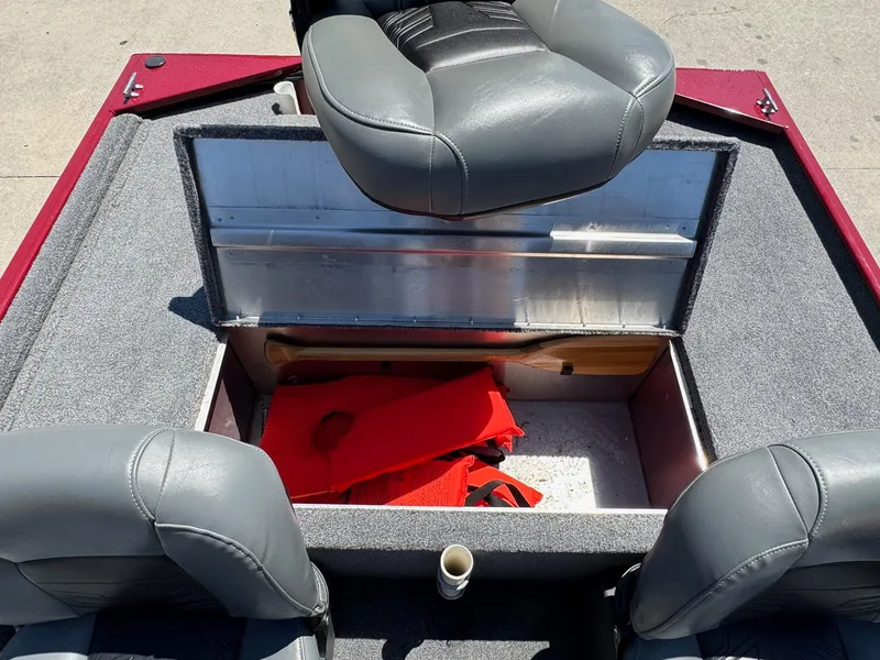 Slide: The Image of 2020 Bass Tracker Classic 16 boat interior with storage compartment and life jackets. - 8