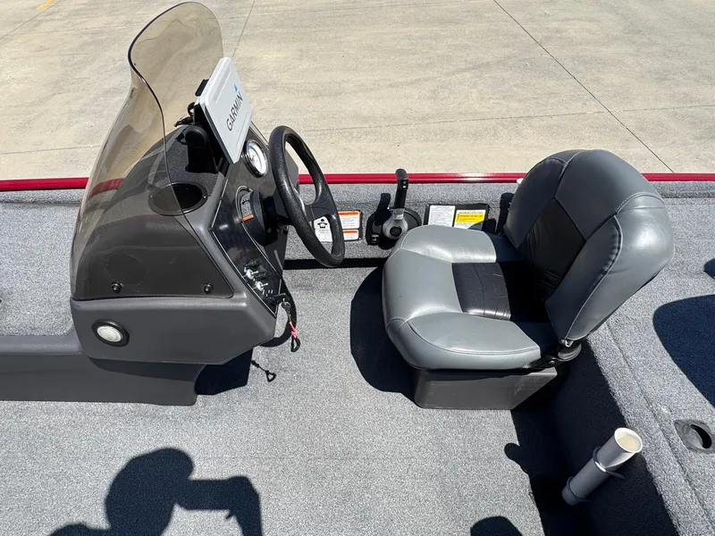 Slide: The Image of 2020 Bass Tracker Classic 16 boat interior with steering console and seat. - 9