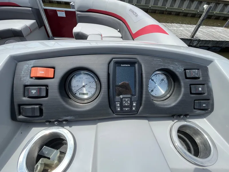 Slide: The Image of Dashboard of 2022 Bennington 22SSRCX boat with gauges and Garmin display. - 13