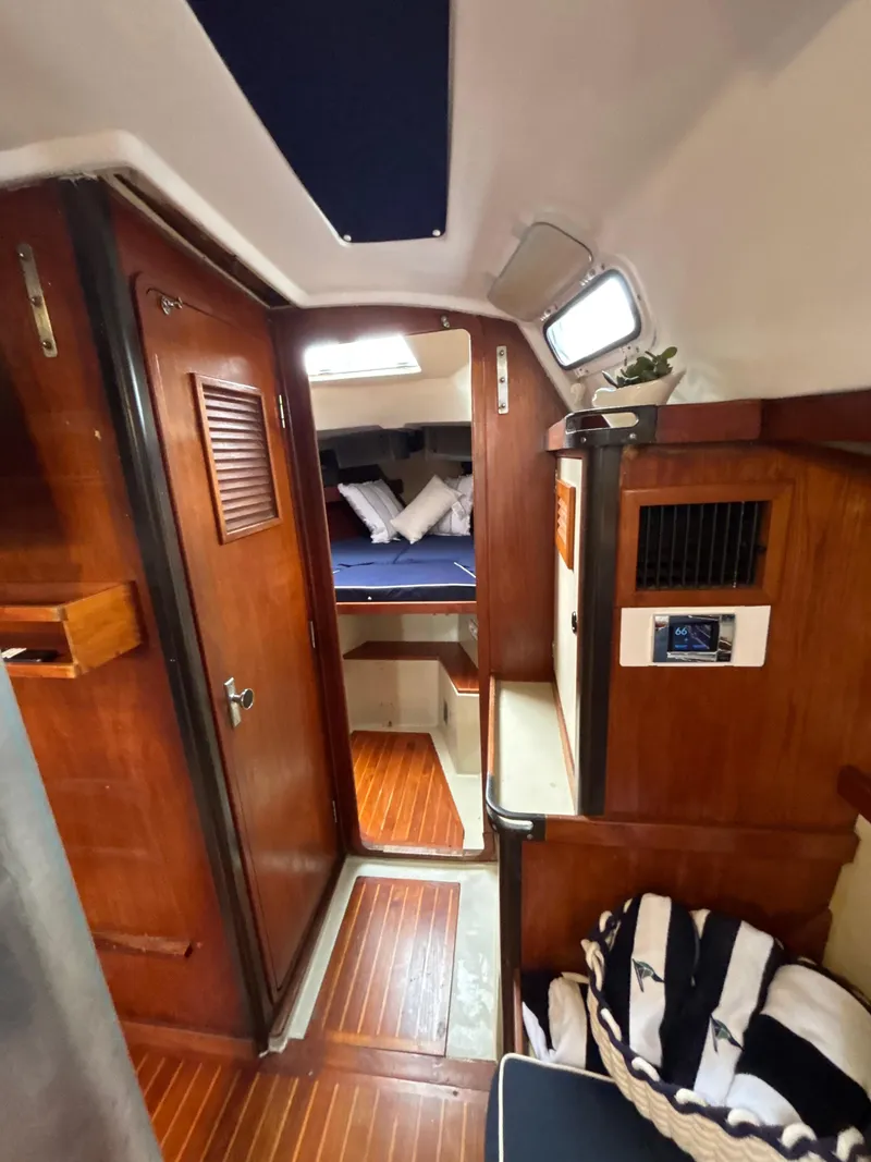 Slide: The Image of Interior of 1981 C&C 37 sailboat with wooden paneling and cozy cabin. - 27