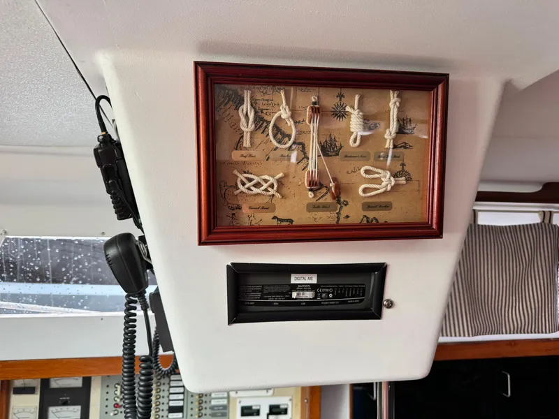 Slide: The Image of Framed nautical knots display on 1981 C&C 37 sailboat interior. - 31