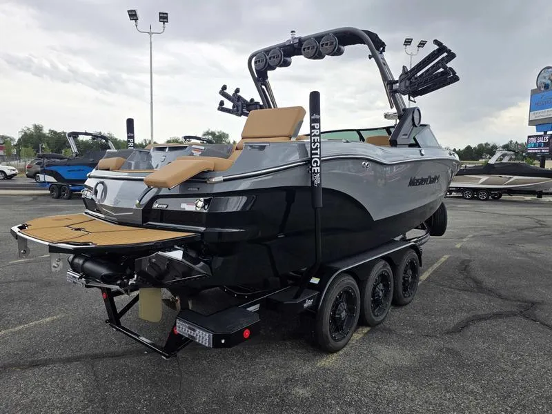 Slide: The Image of 2025 MasterCraft X24 boat on trailer, featuring sleek design and modern amenities. - 8