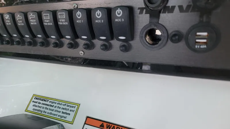 Slide: The Image of Control panel of 2023 Twin Vee 260 CC GF boat with switches and USB ports. - 10