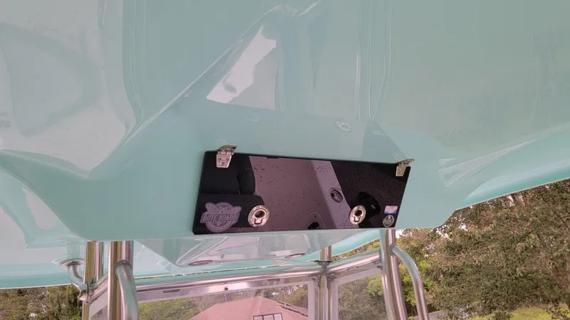 Slide: The Image of 2023 Twin Vee 260 CC GF boat canopy with mounted equipment and metal supports. - 12