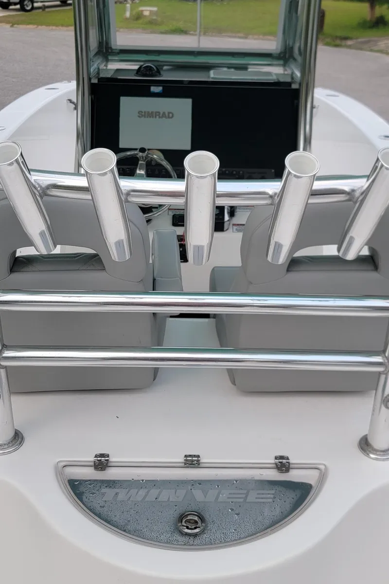 Slide: The Image of 2023 Twin Vee 260 CC GF boat interior with rod holders and Simrad display. - 28
