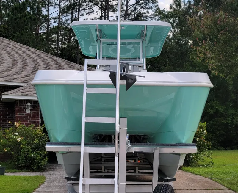 Slide: The Image of 2023 Twin Vee 260 CC GF boat on trailer, parked in driveway. - 3