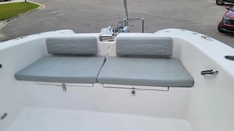 Slide: The Image of 2023 Twin Vee 260 CC GF boat with gray cushioned seating in the bow area. - 37
