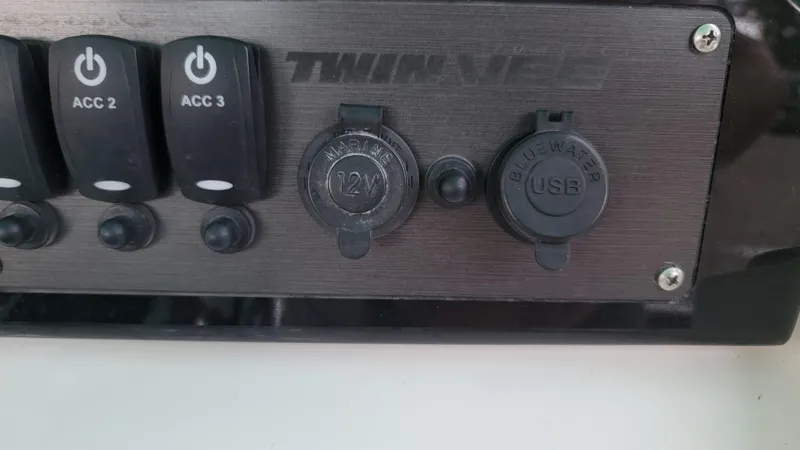 Slide: The Image of Control panel of 2023 Twin Vee 260 CC GF with USB and 12V marine ports. - 8
