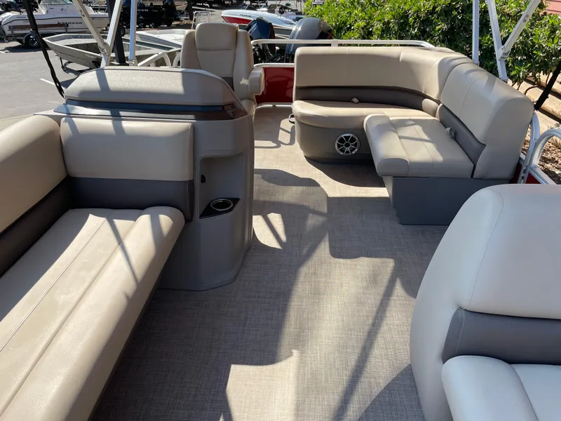 Slide: The Image of 2024 Sun Tracker Party Barge 18 DLX interior with spacious seating and modern design. - 5