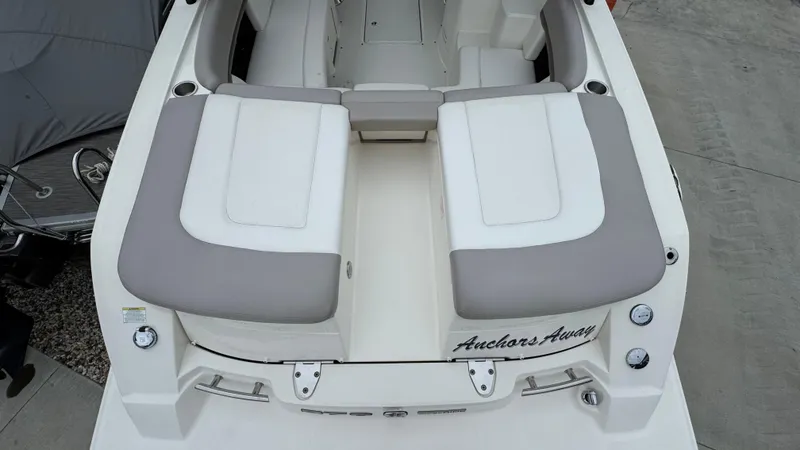 Slide: The Image of 2013 Sea Ray 270 SLX boat with cushioned seating and "Anchors Away" text on the stern. - 10