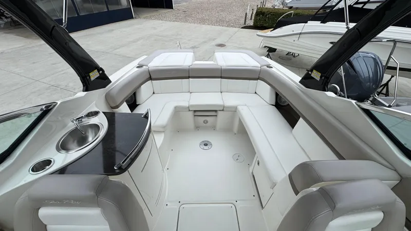 Slide: The Image of Luxurious interior of a 2013 Sea Ray 270 SLX boat with spacious seating and a sink. - 11