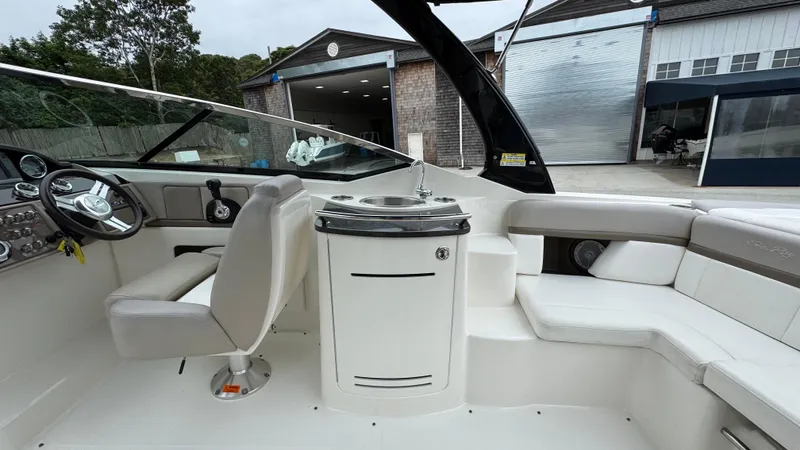 Slide: The Image of Interior of a 2013 Sea Ray 270 SLX boat with helm and seating area. - 17