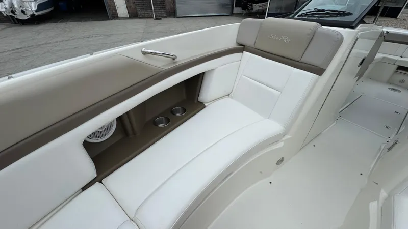 Slide: The Image of 2013 Sea Ray 270 SLX boat interior with white seating and cup holders. - 28