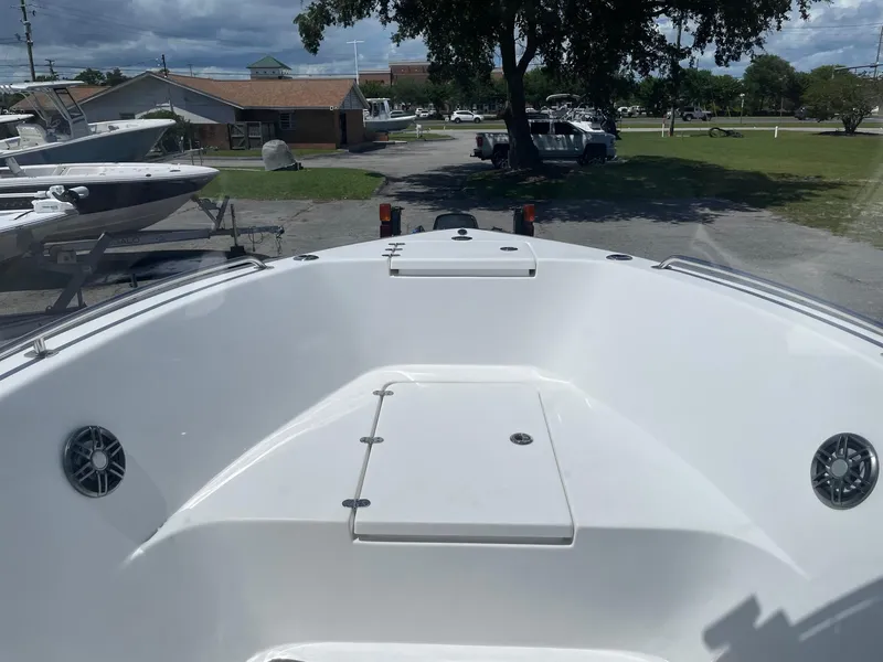 Slide: The Image of 2021 Cape Horn 22 OS boat deck, parked outdoors under cloudy sky. - 10