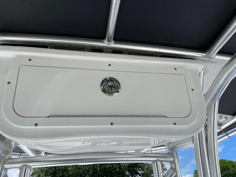 Slide: The Image of 2021 Cape Horn 22 OS boat storage compartment with latch, featuring sleek design and sturdy construction. - 12