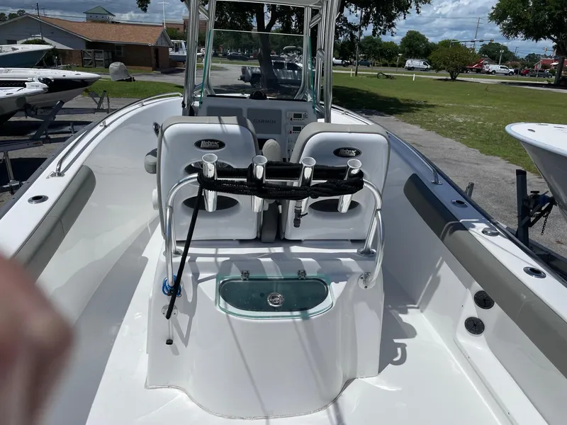 Slide: The Image of 2021 Cape Horn 22 OS boat interior with seating and fishing rod holders. - 17