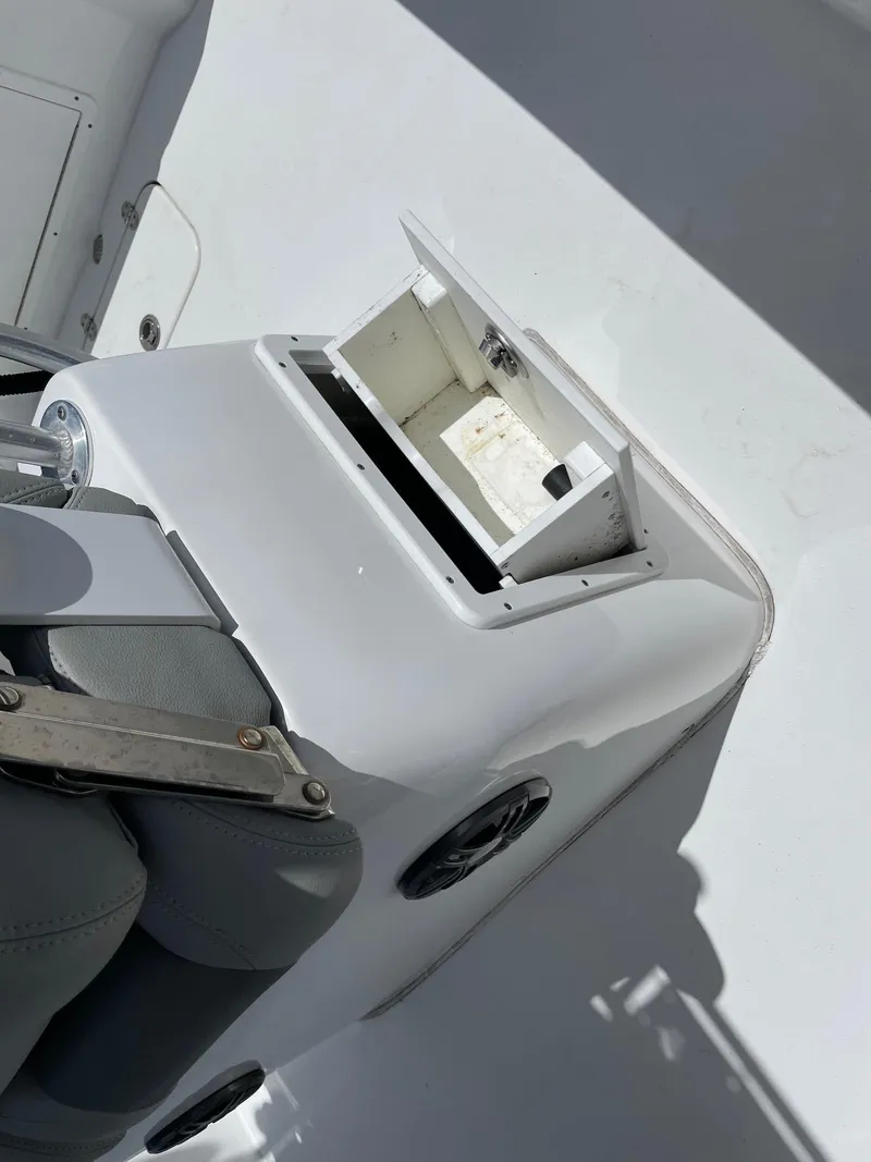 Slide: The Image of 2021 Cape Horn 22 OS boat interior with open storage compartment and seating. - 6