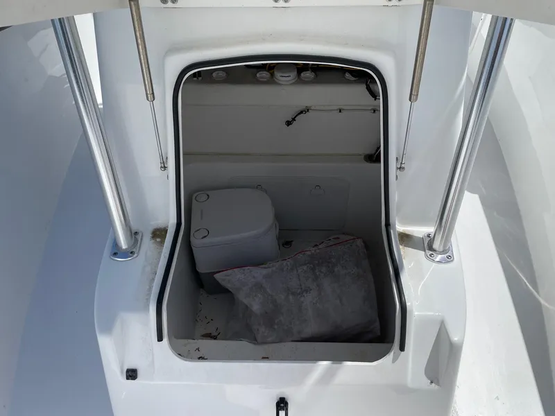 Slide: The Image of 2021 Cape Horn 22 OS boat cabin with portable toilet and storage area. - 7