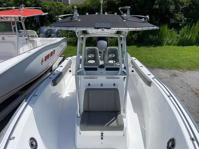 Slide: The Image of 2021 Cape Horn 22 OS boat with T-top and seating, docked outdoors. - 8