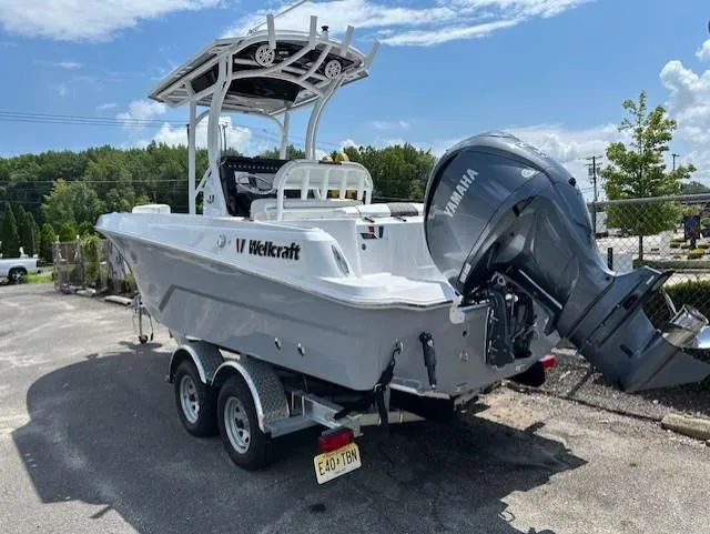 Slide: The Image of 2025 Wellcraft 222 Fisherman boat with Yamaha engine on trailer, parked outdoors. - 3