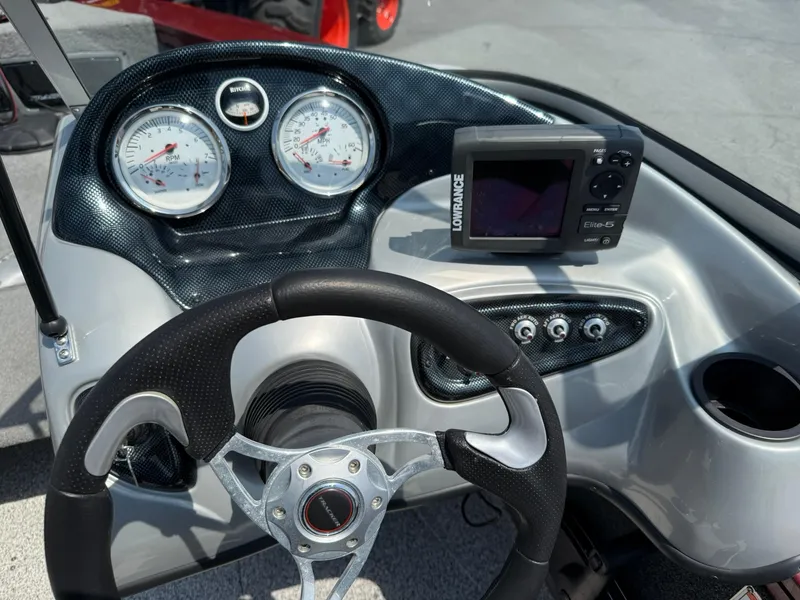 Slide: The Image of 2012 Tracker Targa V-18 Combo dashboard with gauges and Lowrance Elite-5 fishfinder. - 10