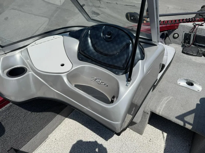 Slide: The Image of 2012 Tracker Targa V-18 Combo boat interior with dashboard and seating area. - 11