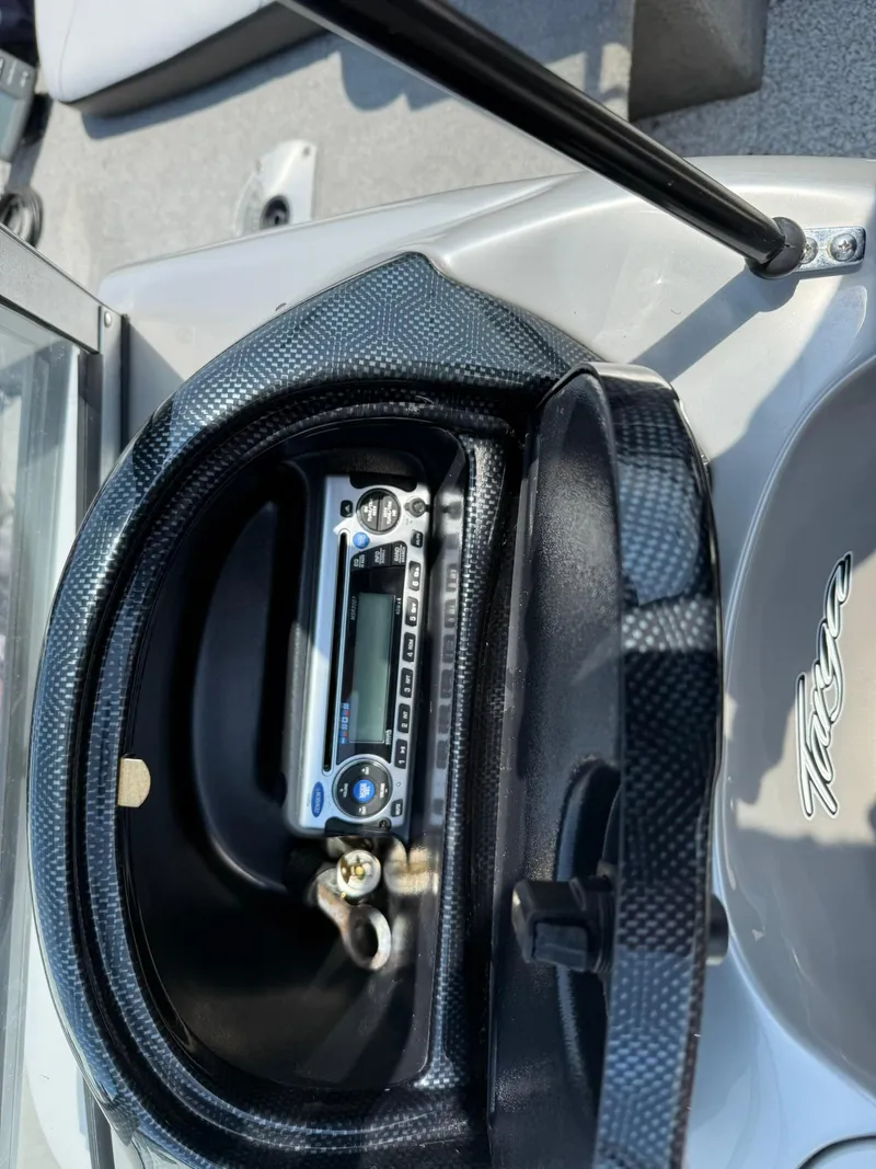 Slide: The Image of 2012 Tracker Targa V-18 Combo boat dashboard with stereo system and carbon fiber trim. - 12