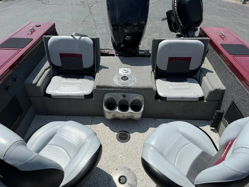 Slide: The Image of 2012 Tracker Targa V-18 Combo boat interior with seating and cup holders. - 14