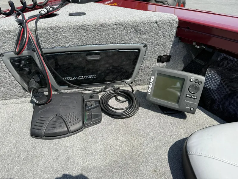 Slide: The Image of 2012 Tracker Targa V-18 Combo boat interior with Lowrance fish finder and foot pedal. - 18