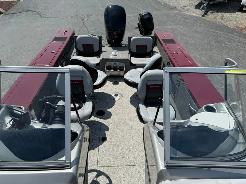 Slide: The Image of 2012 Tracker Targa V-18 Combo boat interior with seating and dashboard view. - 20