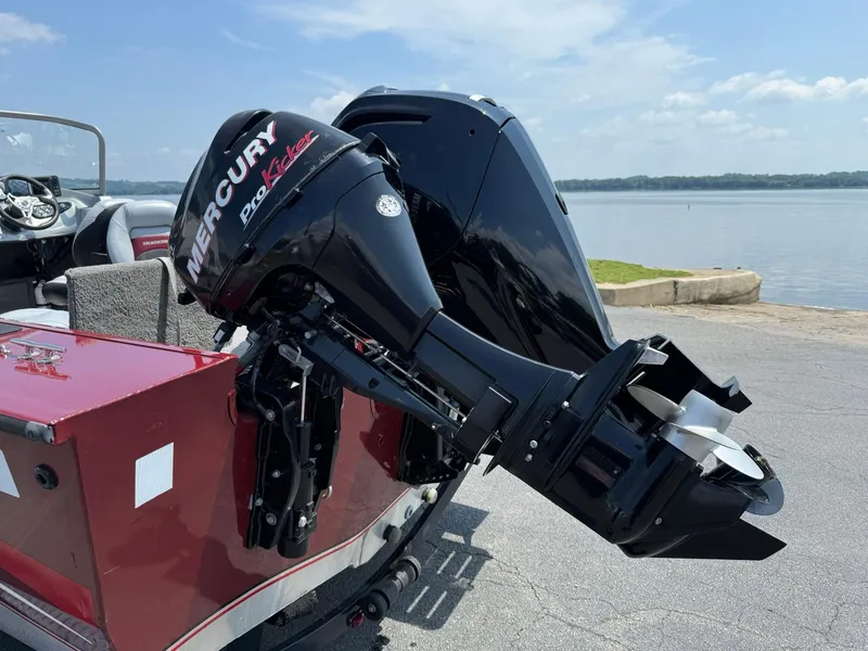 Slide: The Image of 2012 Tracker Targa V-18 Combo boat with Mercury ProKicker motor by a lake. - 3