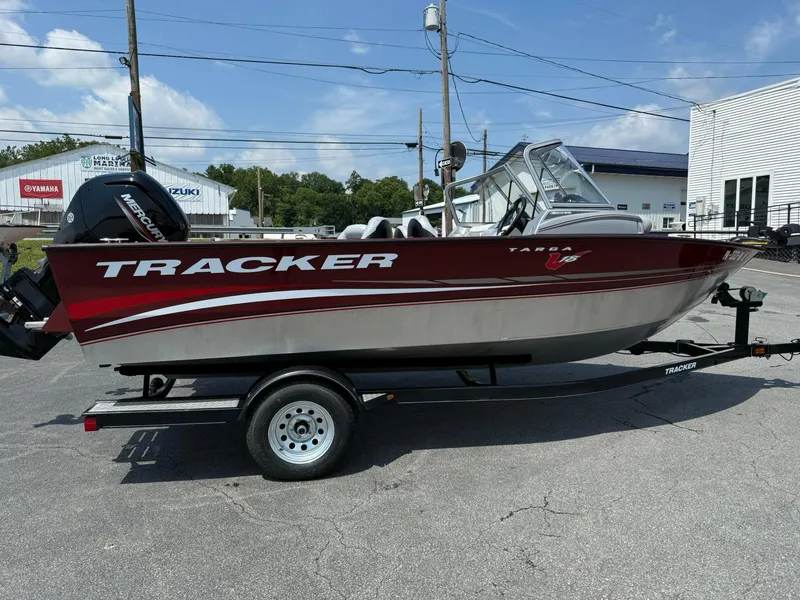 Slide: The Image of 2012 Tracker Targa V-18 Combo boat on trailer, parked outdoors. - 6